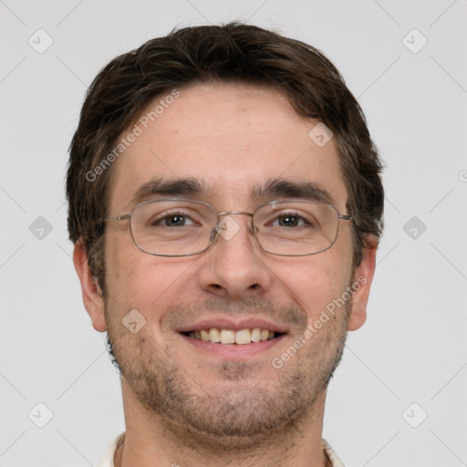 Joyful white adult male with short  brown hair and grey eyes