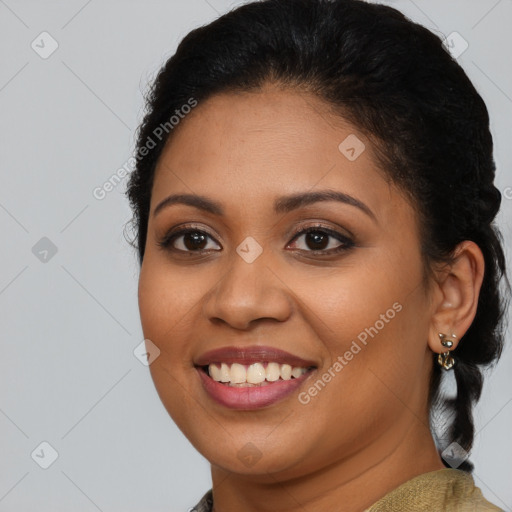 Joyful latino young-adult female with medium  brown hair and brown eyes