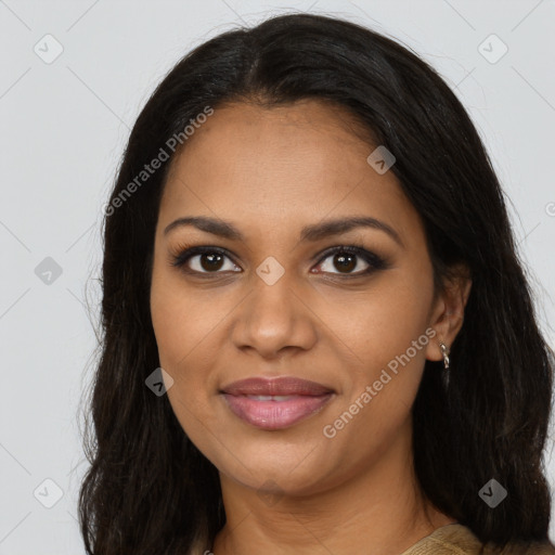 Joyful black young-adult female with long  brown hair and brown eyes