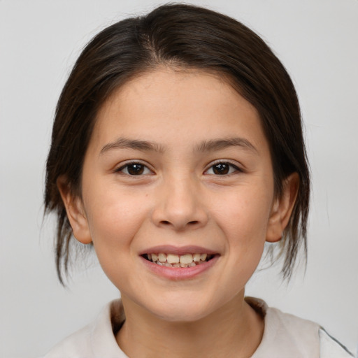 Joyful white child female with medium  brown hair and brown eyes