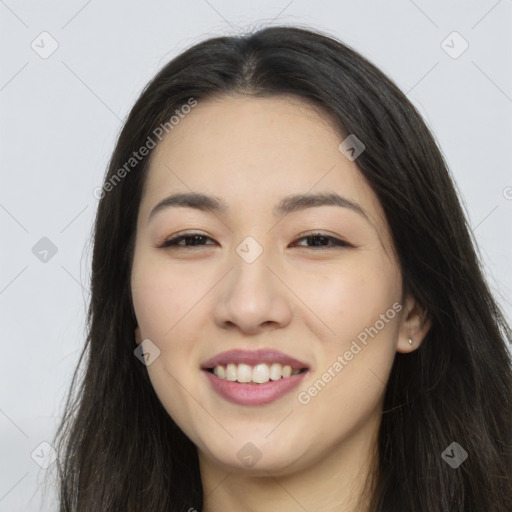 Joyful asian young-adult female with long  brown hair and brown eyes