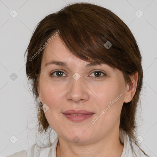 Joyful white adult female with medium  brown hair and grey eyes