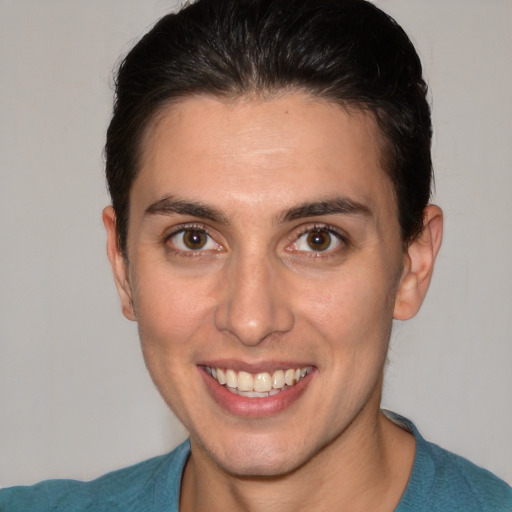 Joyful white young-adult male with short  brown hair and brown eyes