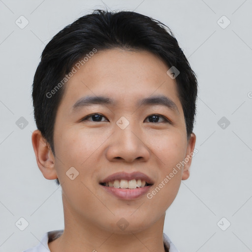 Joyful asian young-adult male with short  black hair and brown eyes