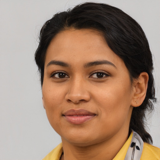 Joyful asian young-adult female with medium  black hair and brown eyes