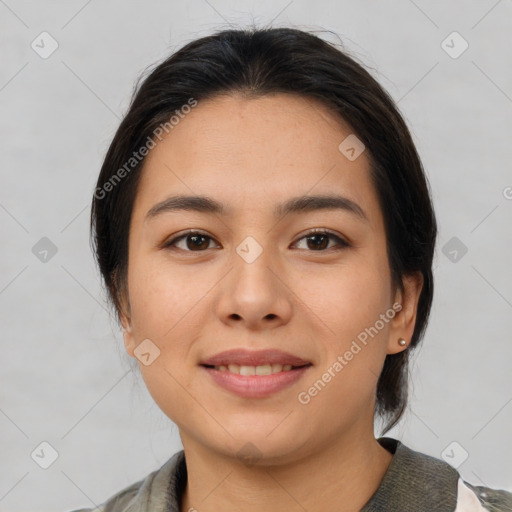 Joyful latino young-adult female with medium  brown hair and brown eyes