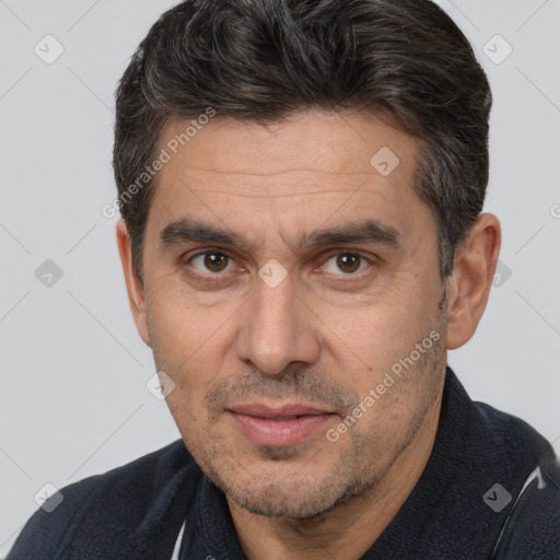 Joyful white adult male with short  brown hair and brown eyes