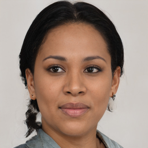 Joyful asian young-adult female with medium  black hair and brown eyes