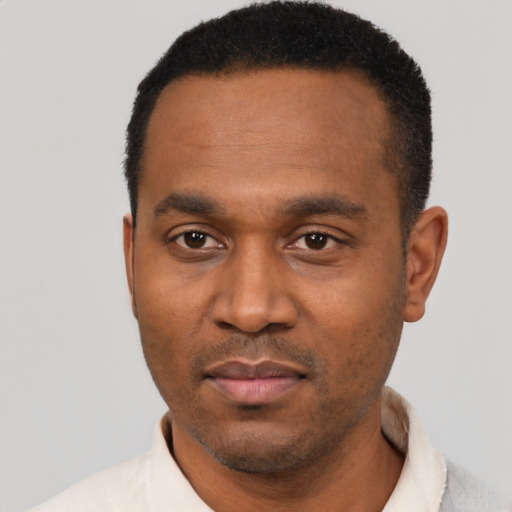 Neutral black young-adult male with short  black hair and brown eyes