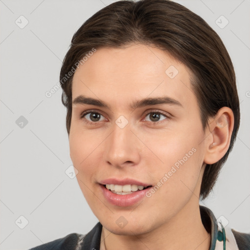 Joyful white young-adult female with medium  brown hair and brown eyes