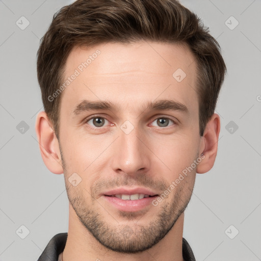 Joyful white young-adult male with short  brown hair and grey eyes