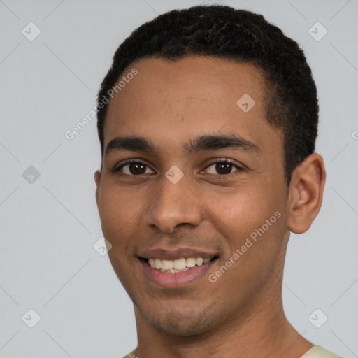 Joyful white young-adult male with short  black hair and brown eyes