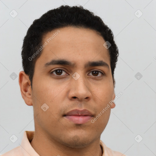 Neutral latino young-adult male with short  brown hair and brown eyes