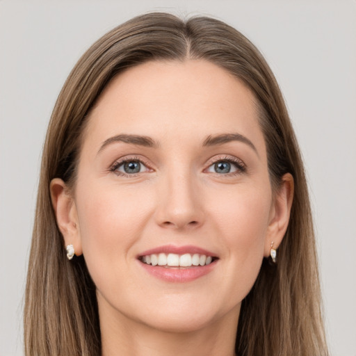 Joyful white young-adult female with long  brown hair and grey eyes