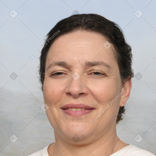 Joyful white adult female with short  brown hair and brown eyes