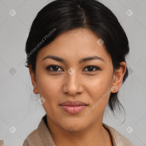 Joyful latino young-adult female with medium  brown hair and brown eyes