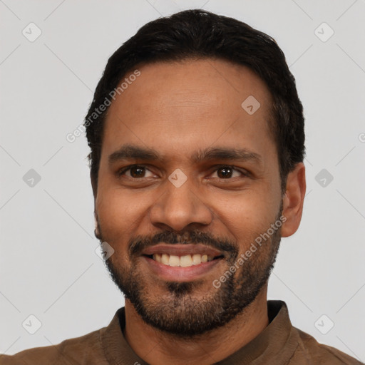 Joyful white young-adult male with short  black hair and brown eyes