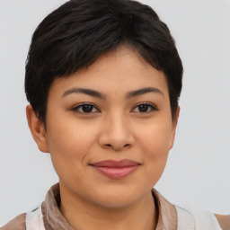 Joyful asian young-adult female with short  brown hair and brown eyes