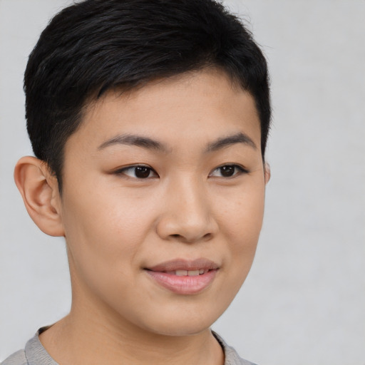 Joyful asian young-adult female with short  brown hair and brown eyes