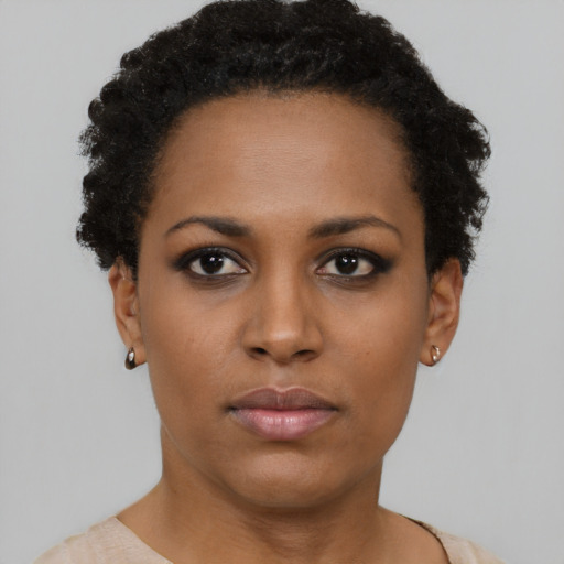Neutral black young-adult female with short  black hair and brown eyes