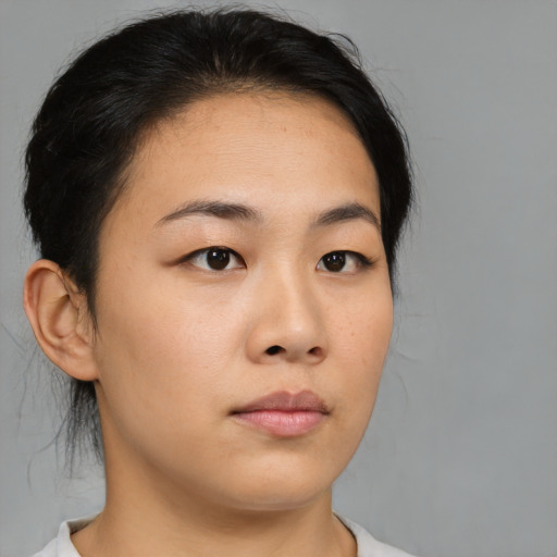 Neutral asian young-adult female with medium  brown hair and brown eyes