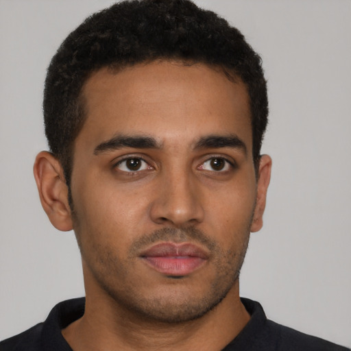 Neutral latino young-adult male with short  brown hair and brown eyes