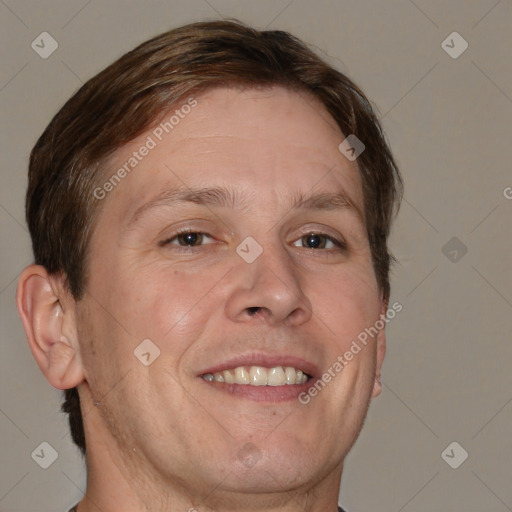 Joyful white adult male with short  brown hair and brown eyes