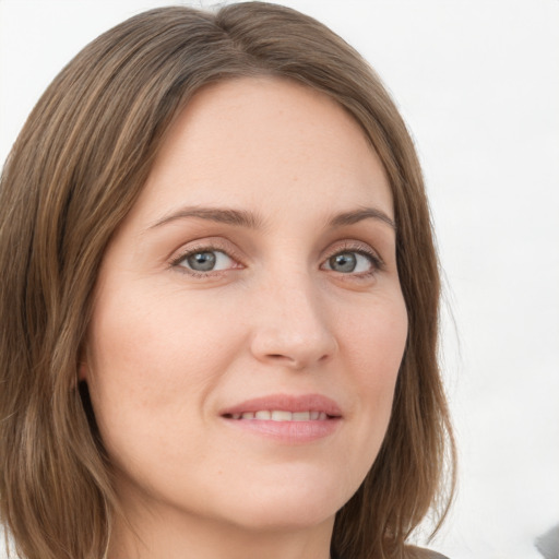 Joyful white young-adult female with medium  brown hair and green eyes