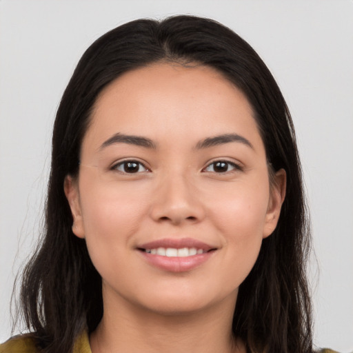 Joyful white young-adult female with long  brown hair and brown eyes