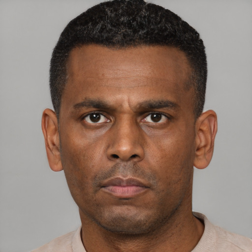 Neutral black young-adult male with short  black hair and brown eyes