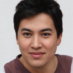 Joyful asian young-adult male with short  brown hair and brown eyes