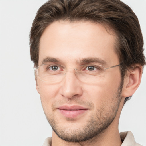 Joyful white adult male with short  brown hair and brown eyes