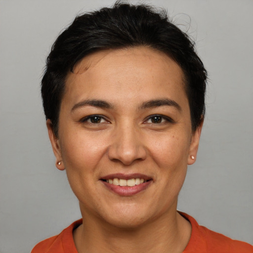 Joyful white young-adult female with short  black hair and brown eyes