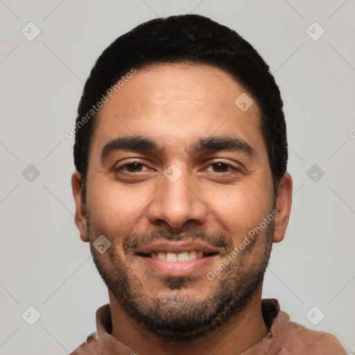 Joyful latino young-adult male with short  black hair and brown eyes