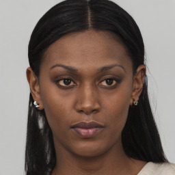 Neutral black young-adult female with long  brown hair and brown eyes