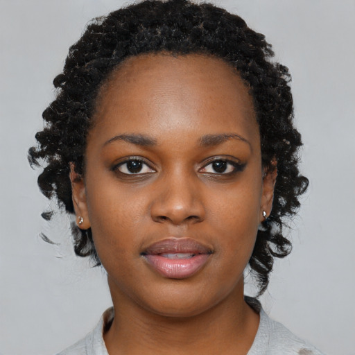 Neutral black young-adult female with medium  black hair and brown eyes