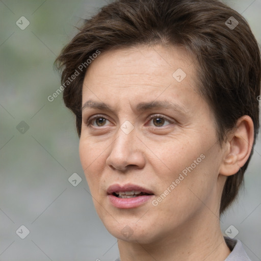 Joyful white adult female with short  brown hair and brown eyes