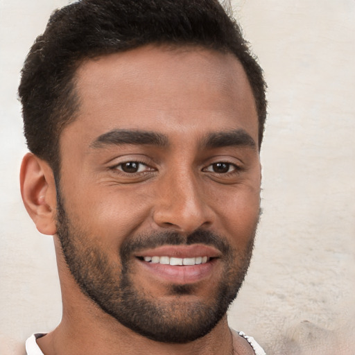 Joyful white young-adult male with short  brown hair and brown eyes