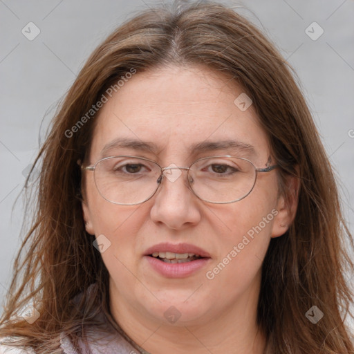 Joyful white adult female with long  brown hair and brown eyes