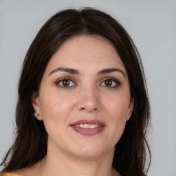 Joyful white young-adult female with medium  brown hair and brown eyes