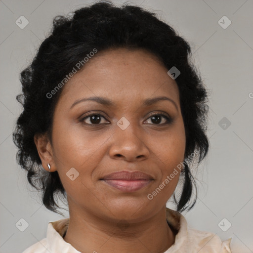 Joyful black adult female with medium  brown hair and brown eyes