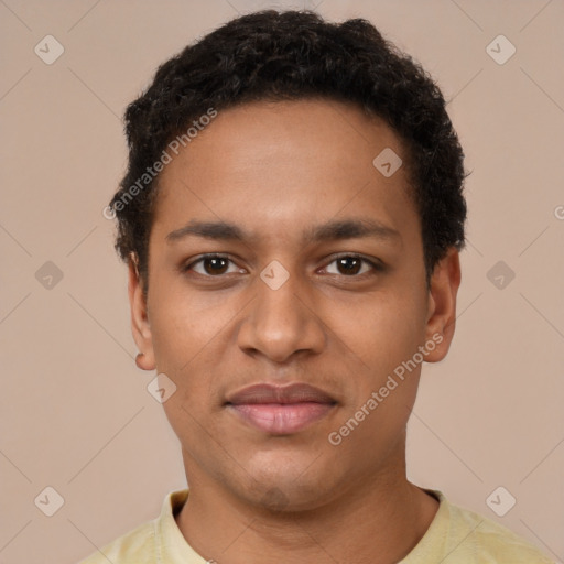 Joyful black young-adult male with short  brown hair and brown eyes