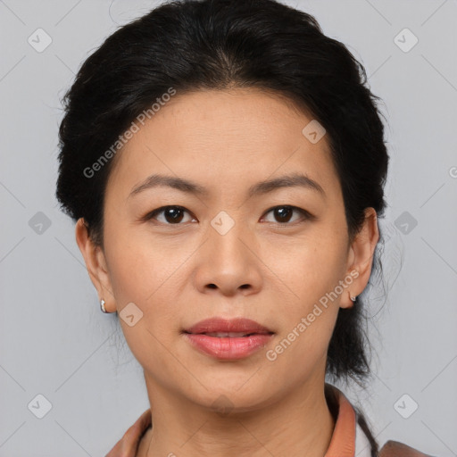 Joyful asian adult female with short  brown hair and brown eyes