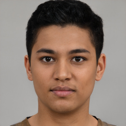 Neutral latino young-adult male with short  brown hair and brown eyes