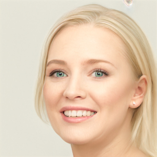 Joyful white young-adult female with long  brown hair and blue eyes