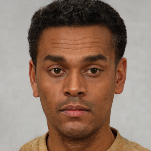 Neutral latino adult male with short  black hair and brown eyes