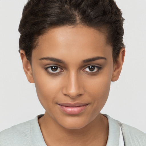 Joyful latino young-adult female with short  brown hair and brown eyes