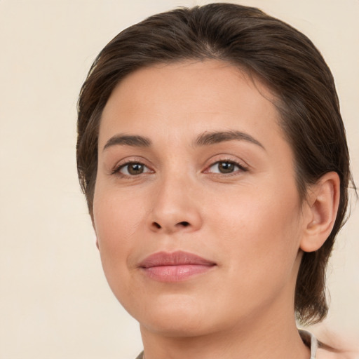 Joyful white young-adult female with medium  brown hair and brown eyes