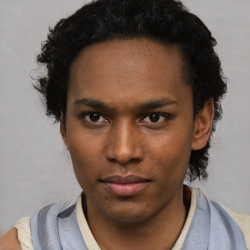 Neutral black young-adult male with short  black hair and brown eyes