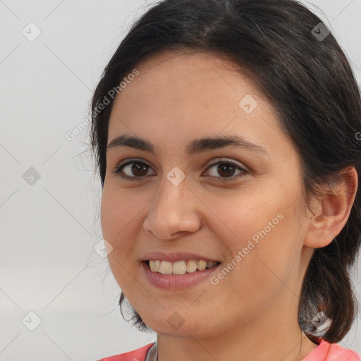 Joyful white young-adult female with long  brown hair and brown eyes